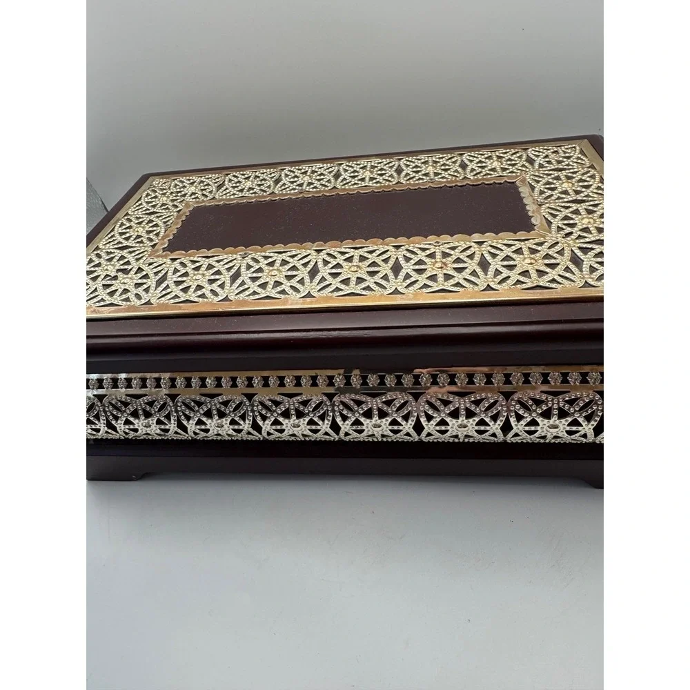 Elegant Wooden Jewelry Box with Ornate Metal Accents and Mirror